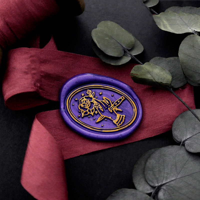 Wax Seal Stamp, created an oval blue wax seal on a red ribbon with rose flower hand dagger design .