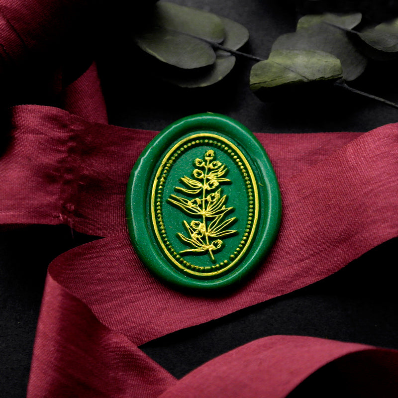 Wax Seal Stamp, created an oval green wax seal on a red ribbon with flower leaves design .