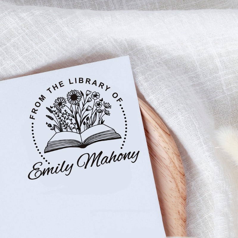 Custom your Book Stamp, with text from the library of your name, sunflowers and book graphic.