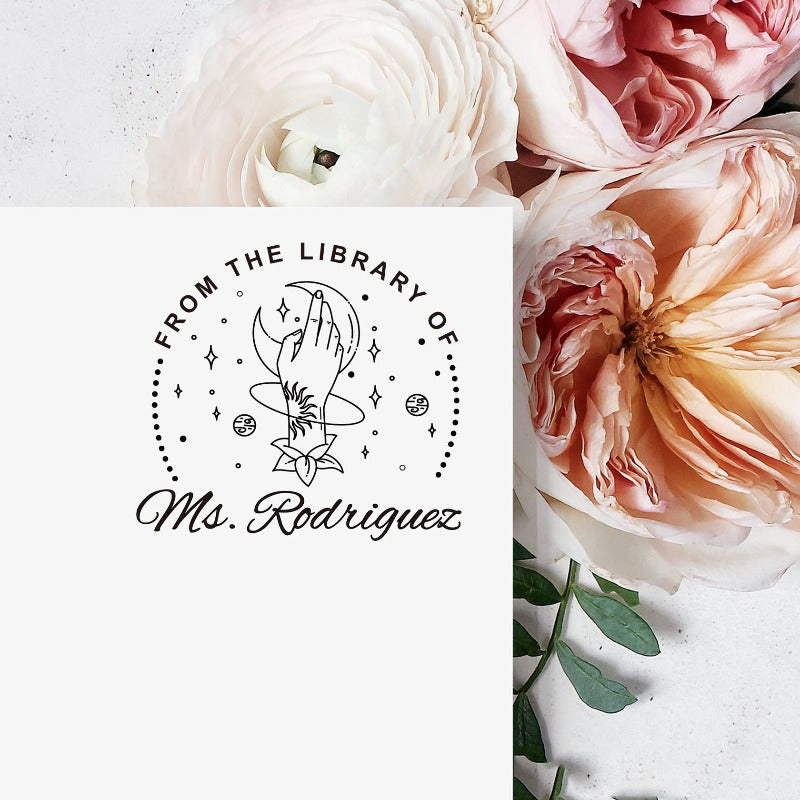 Custom your Book Stamp, with text from the library of your name, moon and hand graphic.
