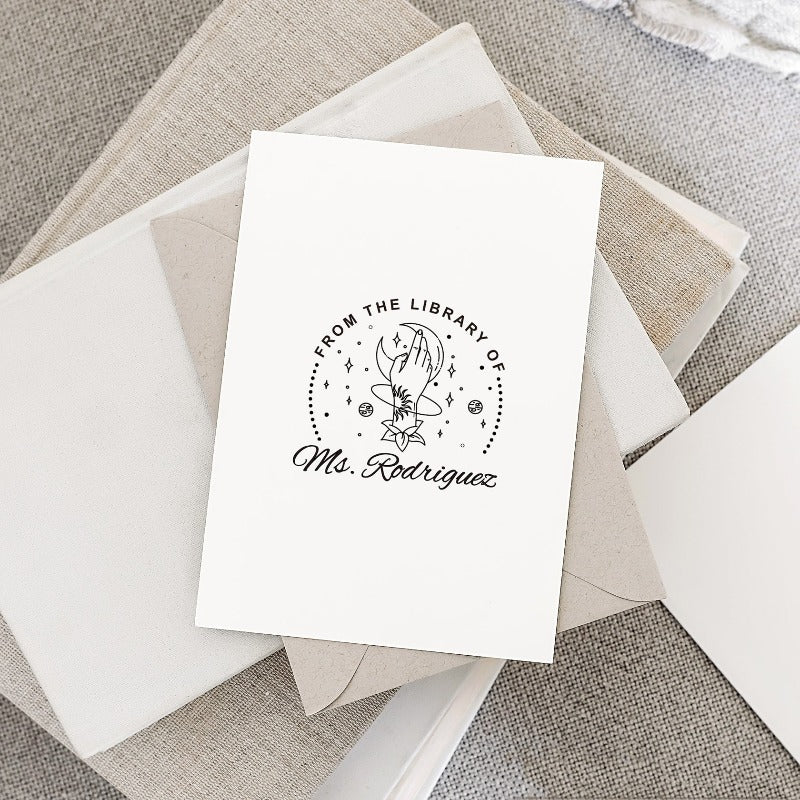 Custom your Book Stamp, with text from the library of your name, moon and hand graphic.
