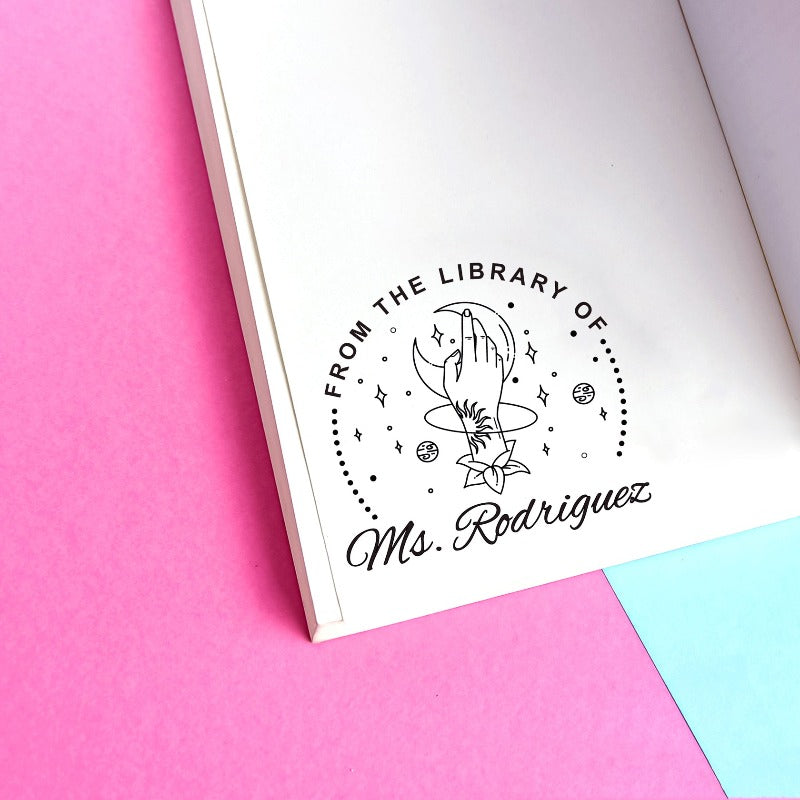 Custom your Book Stamp, with text from the library of your name, moon and hand graphic.