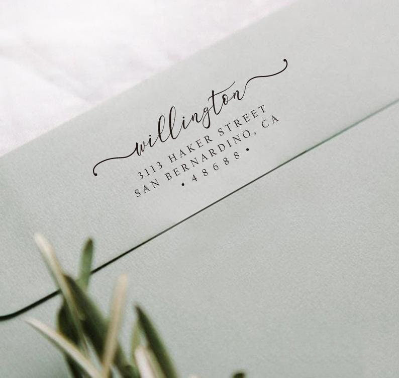 A wedding self inking return address stamp, customized with your name and address, stamped on the gray envelop of invitation card to save your time of hand writing.
