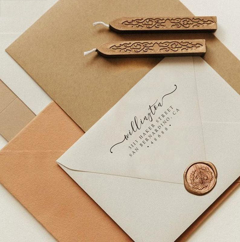 A personalized self inking return address stamp, customized with your name and address, stamped on the white envelope to save your time of hand writing, beside it, sealing wax is creating a wax seal on the mail.