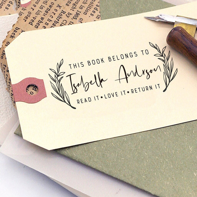 Custom Book Stamp, the top is text -This book belongs to, the centre is to custom your name, on its left and right is leaves, the bottom is text-read it.love it.return it.