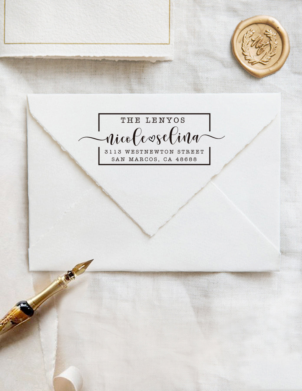 A personalized self inking address stamp, customized with your name and address, stamped on the white envelope, beside it, a wax seal is waiting for sealing the mail.