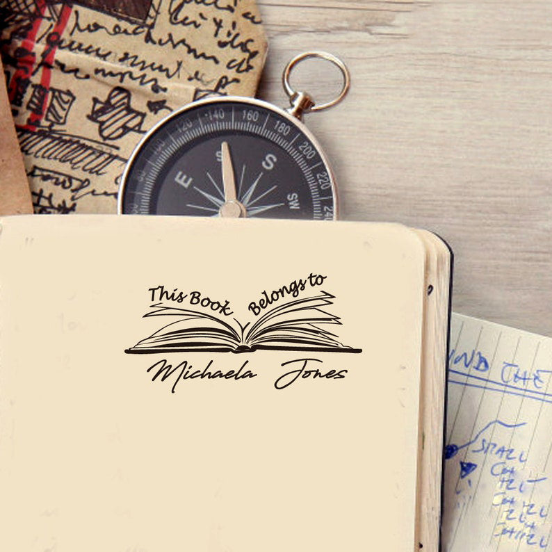 Custom your Book Stamp, with text this book belongs to and a book graphic.