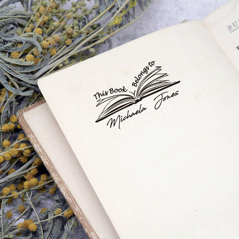 Custom your Book Stamp, with text this book belongs to and a book graphic.