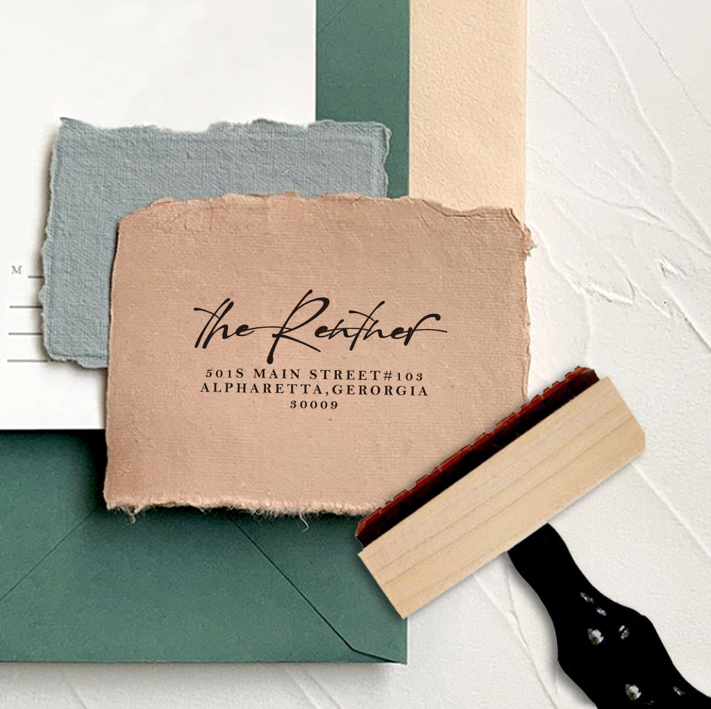 A personalized self inking address stamp, customized with your name and address, stamped on the craft paper.