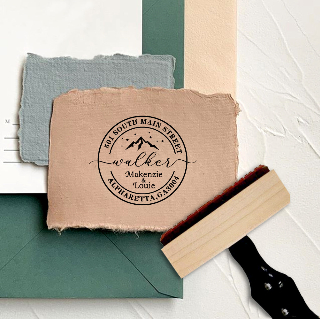 A personalized self inking address stamp, customized with your name, address and mountain, stamped on the craft paper.