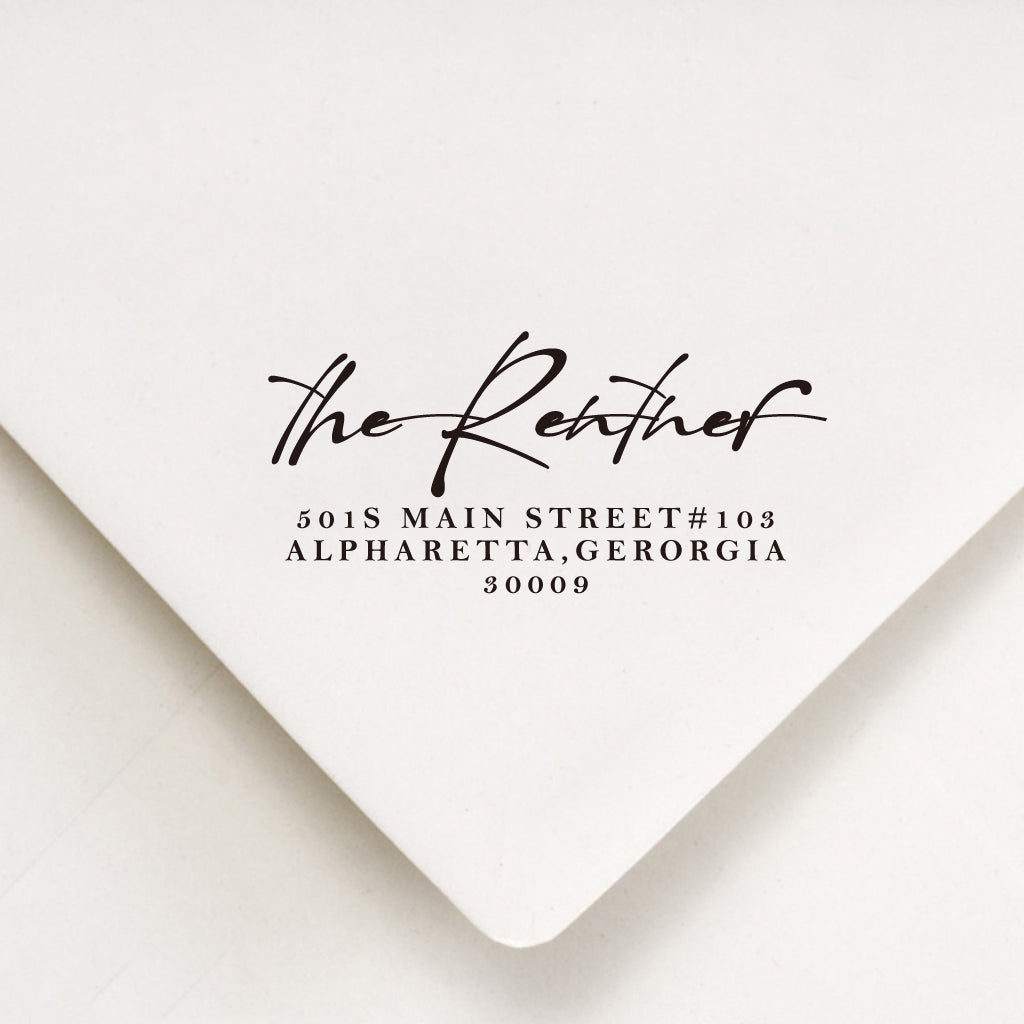 A personalized self inking return address stamp, customized with your shop name and address, stamped on the white envelope.