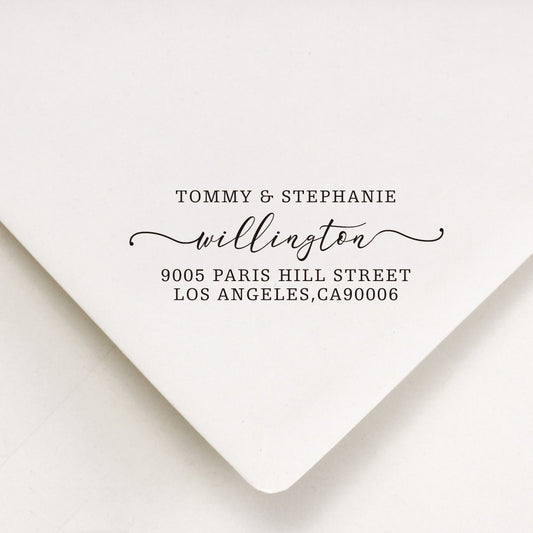 A personalized self inking return address stamp, customized with your name and address, stamped on the white envelope.