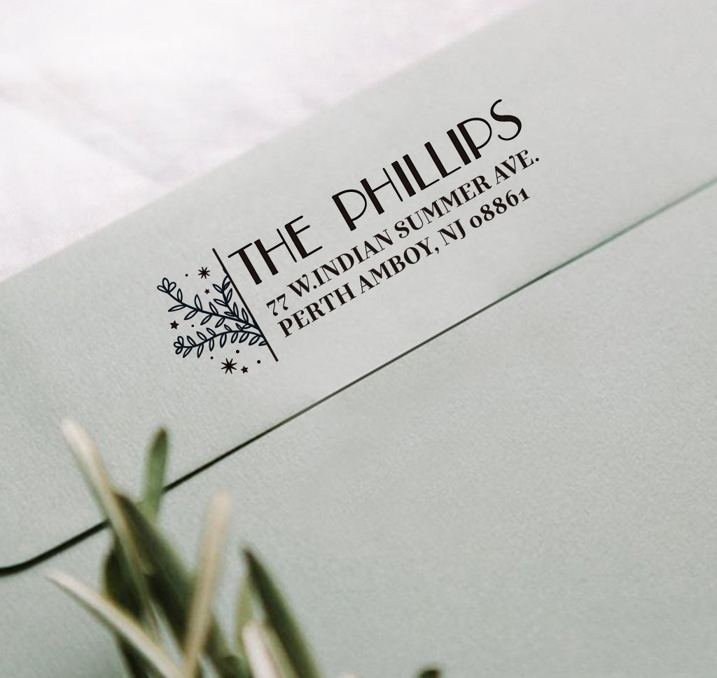 A personalized self inking address stamp, customized with your shop name and address, stamped on the gray envelope.