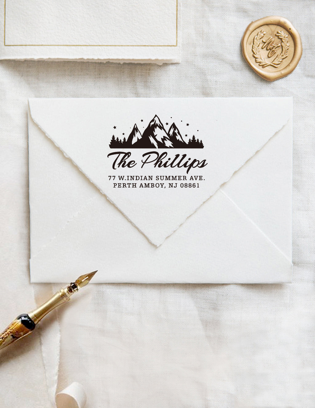 A personalized self inking address stamp, customized with your mountain name and address, stamped on the white envelope, beside it, a wax seal is waiting for sealing the mail.