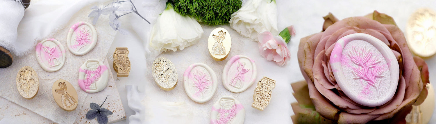 white and pink wax seals and brass wax stamp heads.