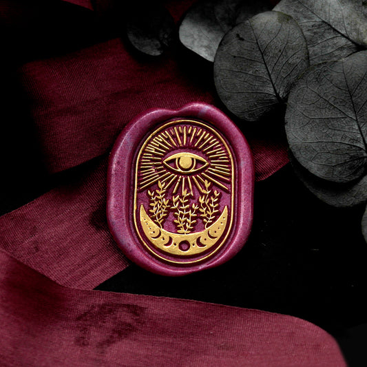 Wax Seal Stamp, created a wax seal on a red ribbon with eye plant moon design