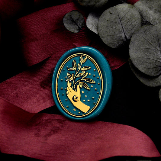 Wax Seal Stamp, created a wax seal on a red ribbon with leaves in hand design