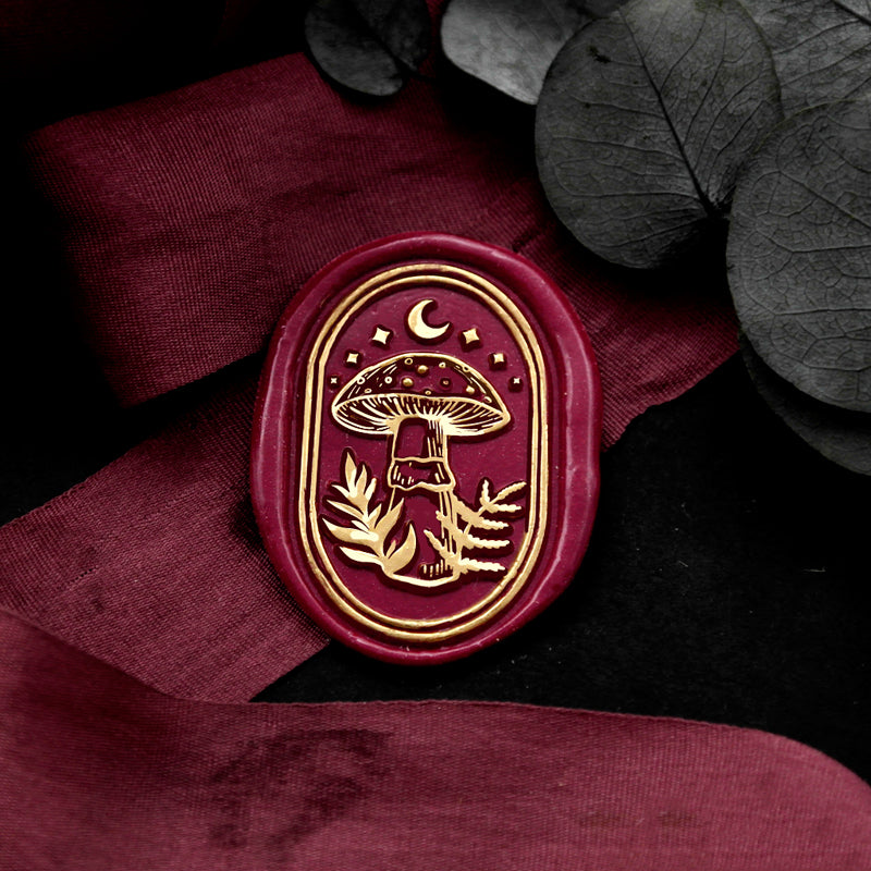 Wax Seal Stamp, created a wax seal on a red ribbon with mushroom design