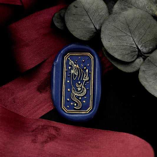 Wax Seal Stamp, created a wax seal on a red ribbon with snake hand design