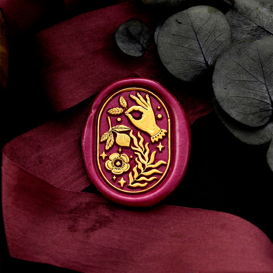 Wax Seal Stamp, created a wax seal on a red ribbon with graden ok hand design