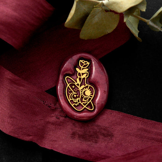 Wax Seal Stamp, created a wax seal on a red ribbon with flower drifting bottle design