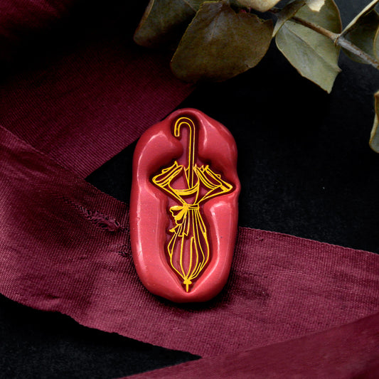 Wax Seal Stamp, created a wax seal on a red ribbon with umbrella design