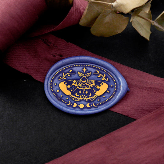 Wax Seal Stamp, created a wax seal on a red ribbon with moth moon phases design