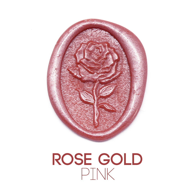 a rose flower wax seal just to show the effect of Rose Gold Pink sealing wax sticks.