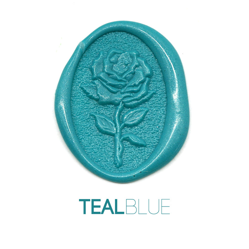 a rose flower wax seal just to show the effect of teal blue sealing wax beads.