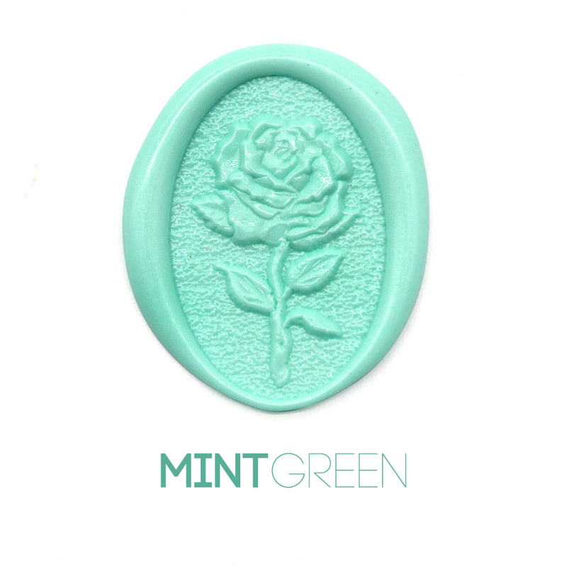 a rose flower wax seal just to show the effect of mint green sealing wax beads.