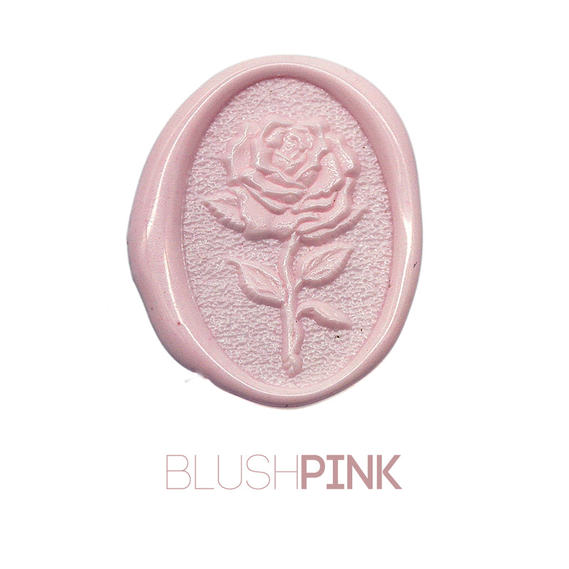 a rose flower wax seal just to show the effect of blush pink sealing wax beads.