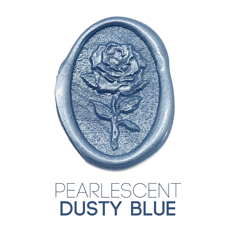 a rose flower wax seal just to show the effect of pearlescent dusty blue sealing wax beads.