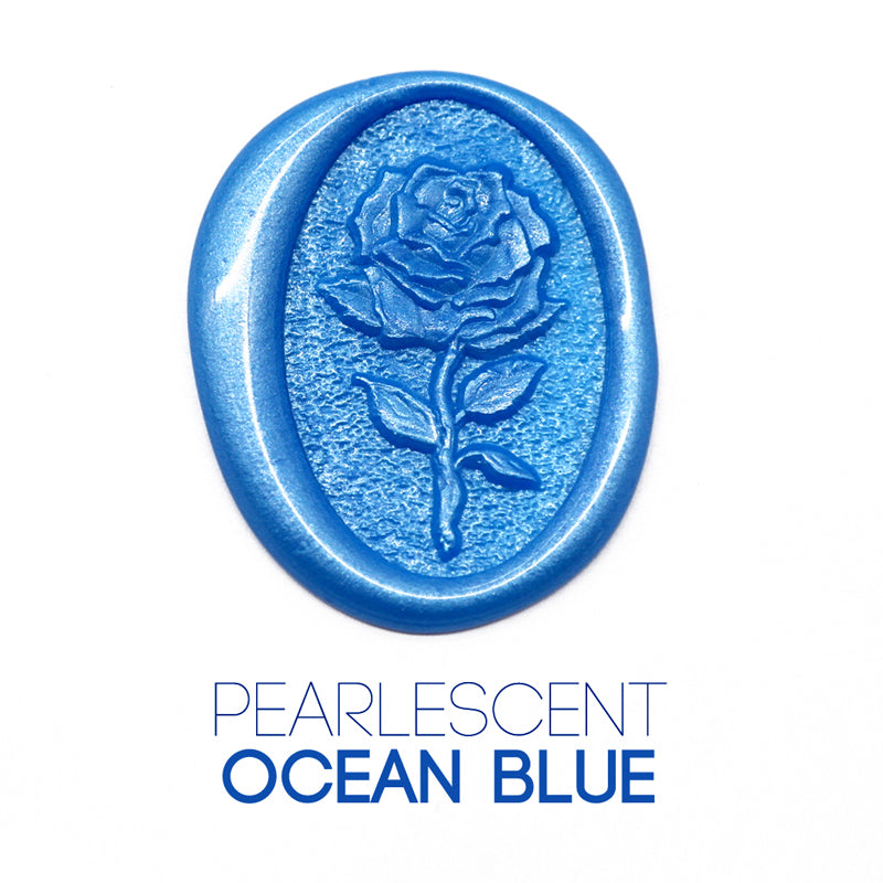 a rose flower wax seal just to show the effect of pearlescent ocean blue sealing wax beads.