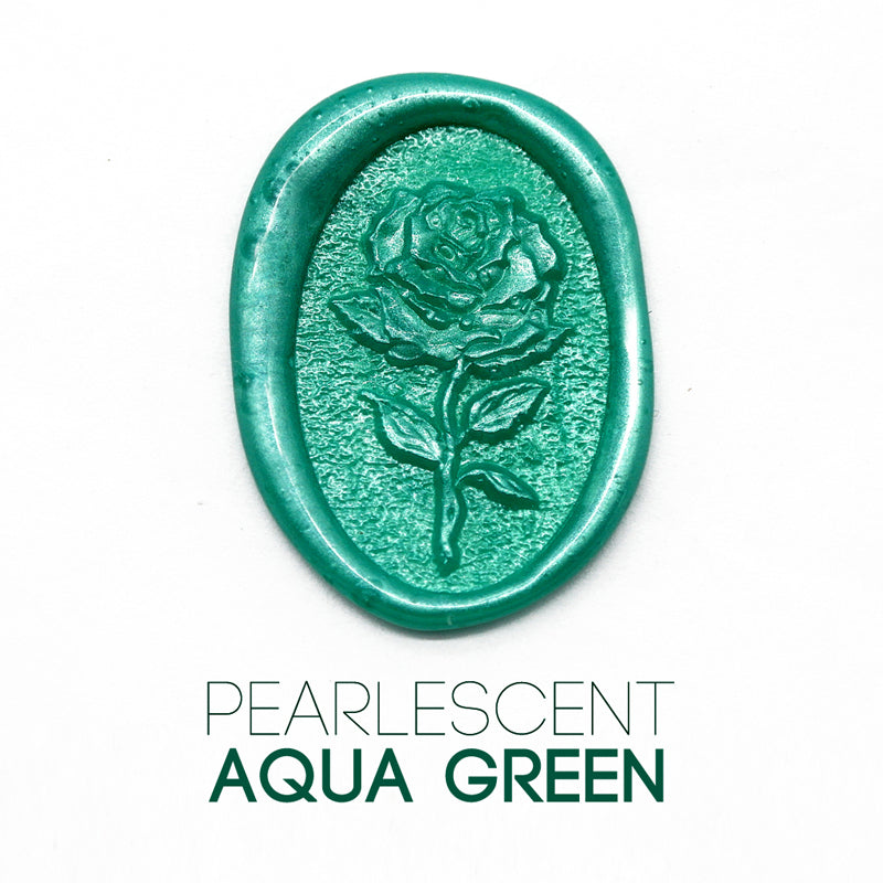 a rose flower wax seal just to show the effect of pearlescent aqua green sealing wax beads.