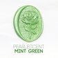a rose flower wax seal just to show the effect of pearlescent mint green sealing wax beads.