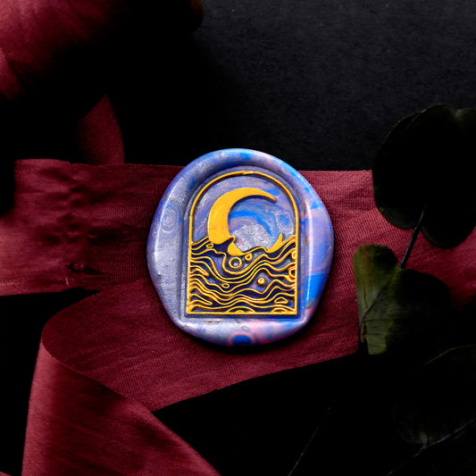 Wax Seal Stamp, created a blue wax seal on a red ribbon with arch window moon galaxy waves design .