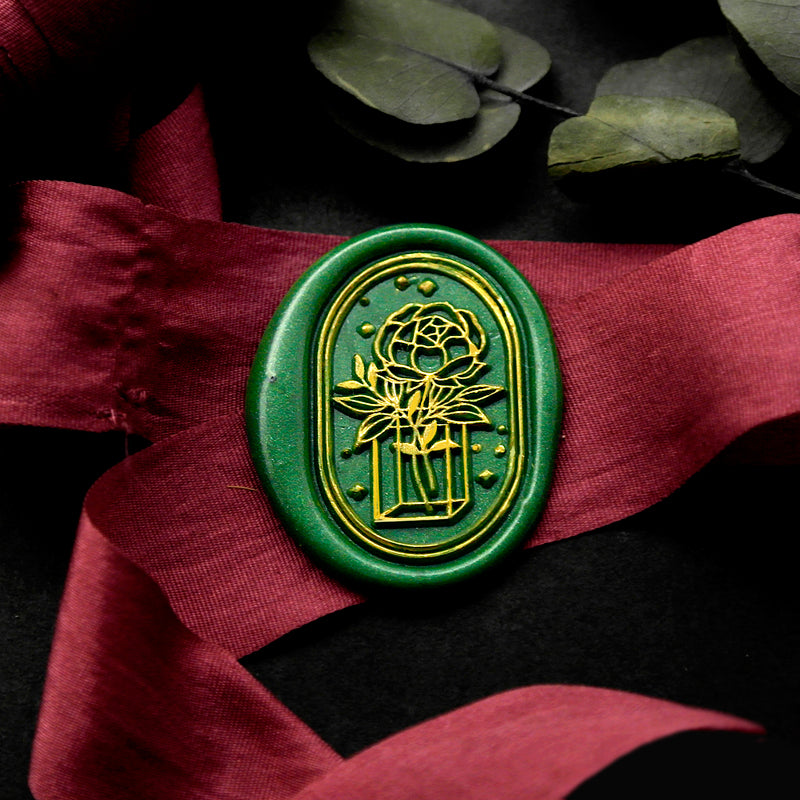 Wax Seal Stamp, created an oval green wax seal on a red ribbon with rose cube vase stars design