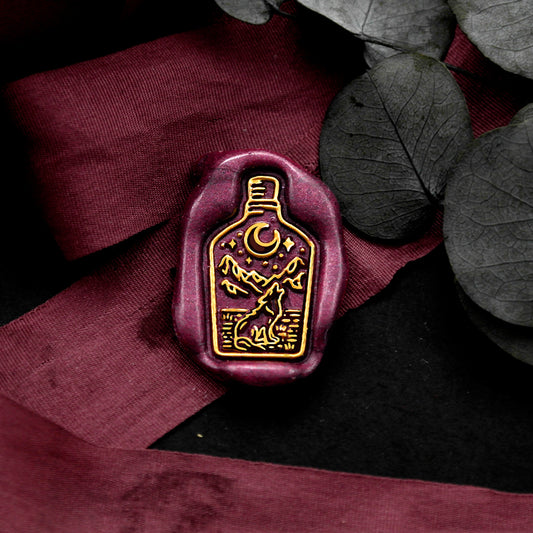 Wax Seal Stamp, created a wax seal on a red ribbon with wolf moom stars mountain drifting bottle design