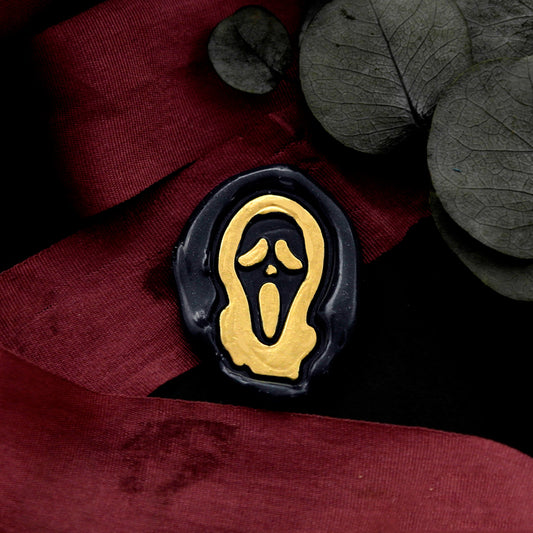 Wax Seal Stamp, created a wax seal on a red ribbon with skeleton ghost face halloween design