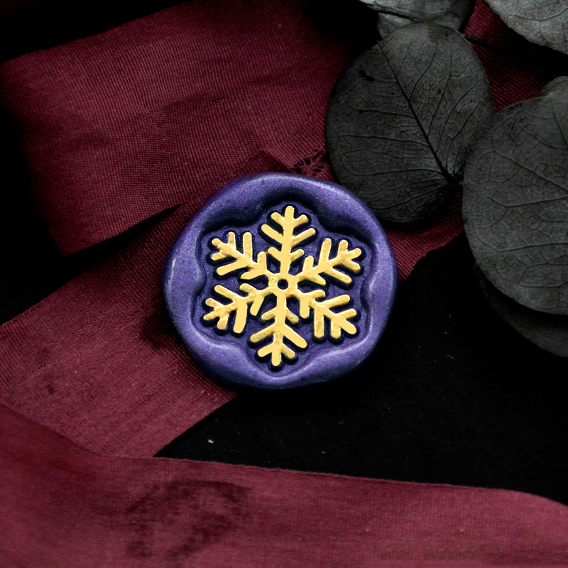 Wax Seal Stamp, created an wax seal on a red ribbon with christmas snowflake design