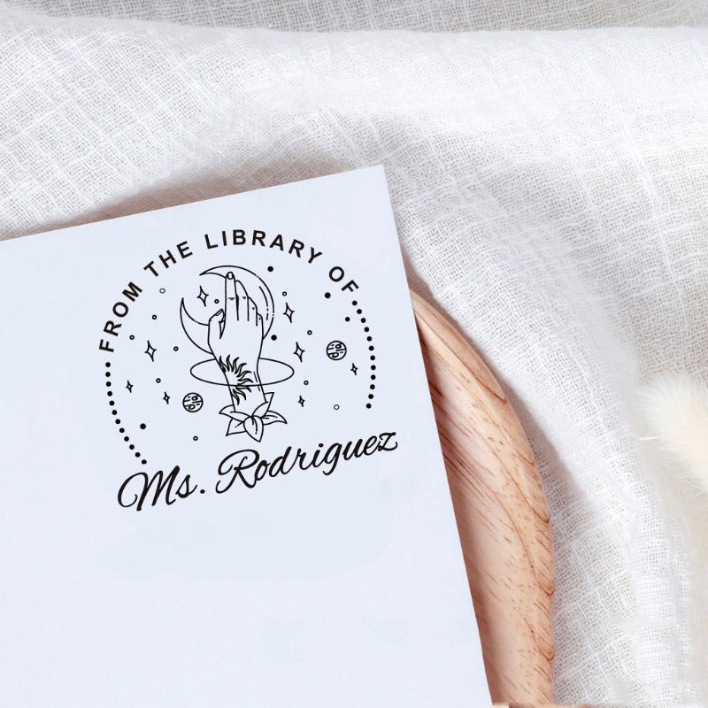 Custom your Book Stamp, with text from the library of your name, moon and hand graphic.