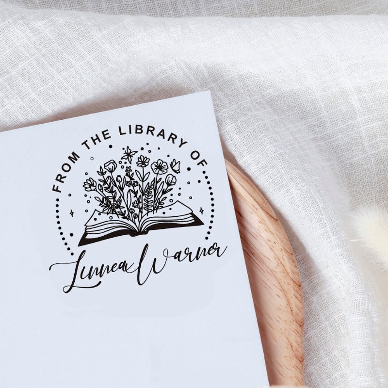 Custom your Book Stamp, with text from the library of your name, flower and books graphic.