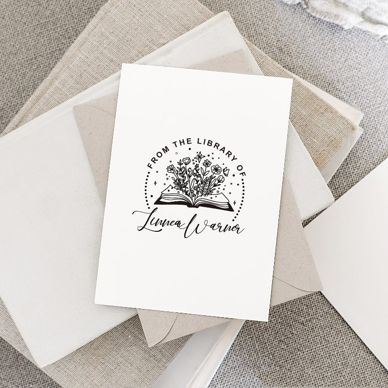 Custom your Book Stamp, with text from the library of your name, flower and books graphic.