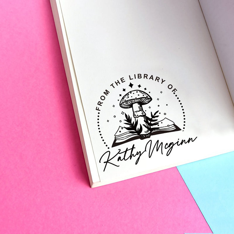 Custom your Book Stamp, with text from the library of your name, mushroom and book graphic.