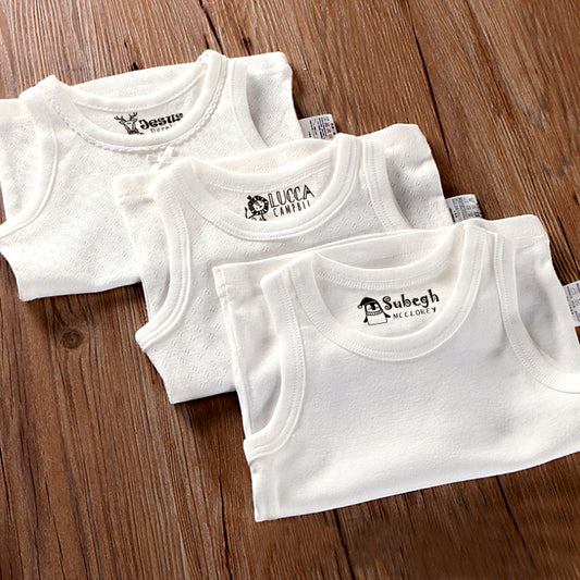 custom clothing stamp, imprinted on 3 white vest. The top one is a dear with custom name, the middle one is a lion with custom name, the bottom one is a penguin with custom name