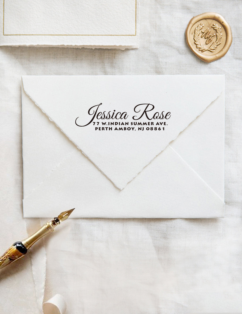 A personalized self inking address stamp, customized with your name and address, stamped on the white envelope, beside it, a wax seal is waiting for sealing the mail. 