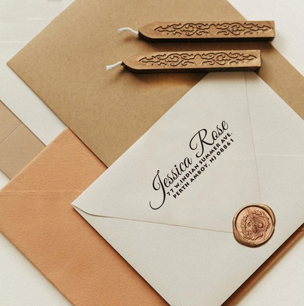 A personalized self inking return address stamp, customized with your name and address, stamped on the white envelope, beside it, sealing wax is creating a wax seal on the mail.
