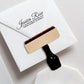 A personalized self inking return address stamp, customized with your name and address, stamped on the white envelope.