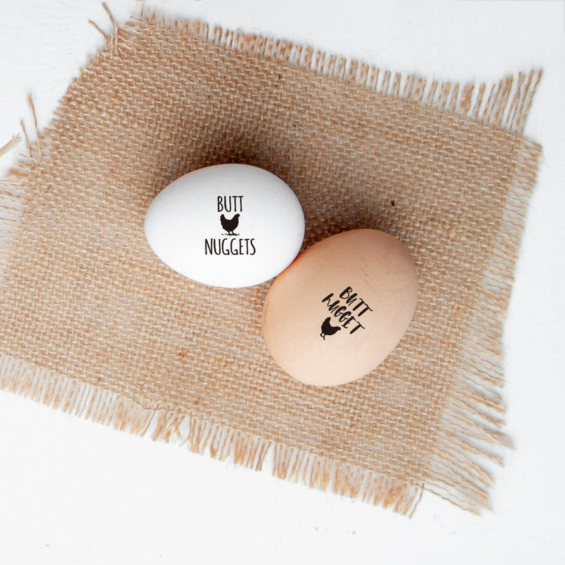 mini egg stamps, imprinted on the farm eggs with BUTT NUGGET Word and hen .