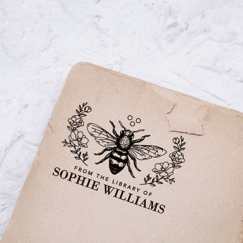 Custom stamp, the top is bee and flower, the bottom is to personalize the name of Library.
